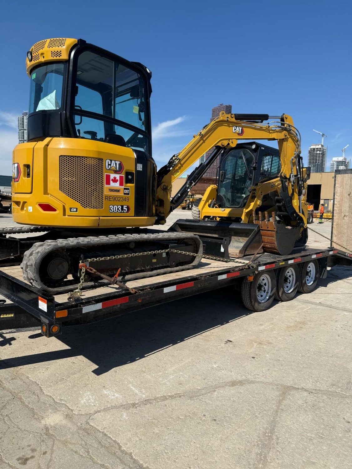 CAT 303.5 excavator and skid steer on the float trailer